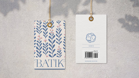 Closeup of the front and back of retail store clothing tag