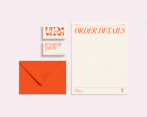 Collage of orange envelope, and business card and stationery for Vira