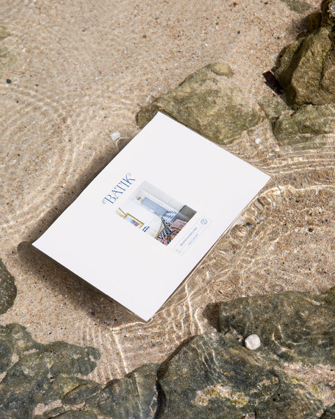 Closeup of brand guidelines booklet laying in shallow water