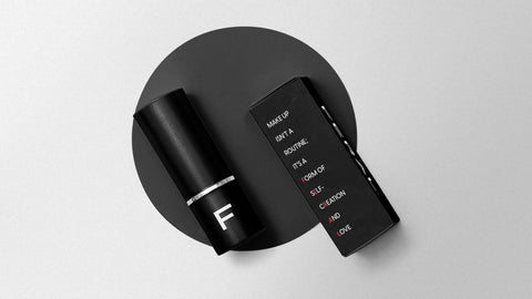 Closeup of black packaging for Feral Cosmetics