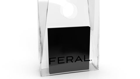Transparent shopping bag with a black, Feral branded box inside